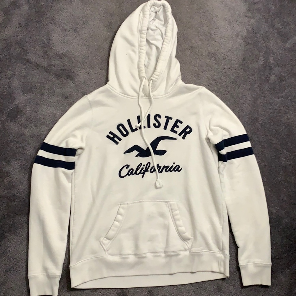 A white and black thick hollister sweatshirt.